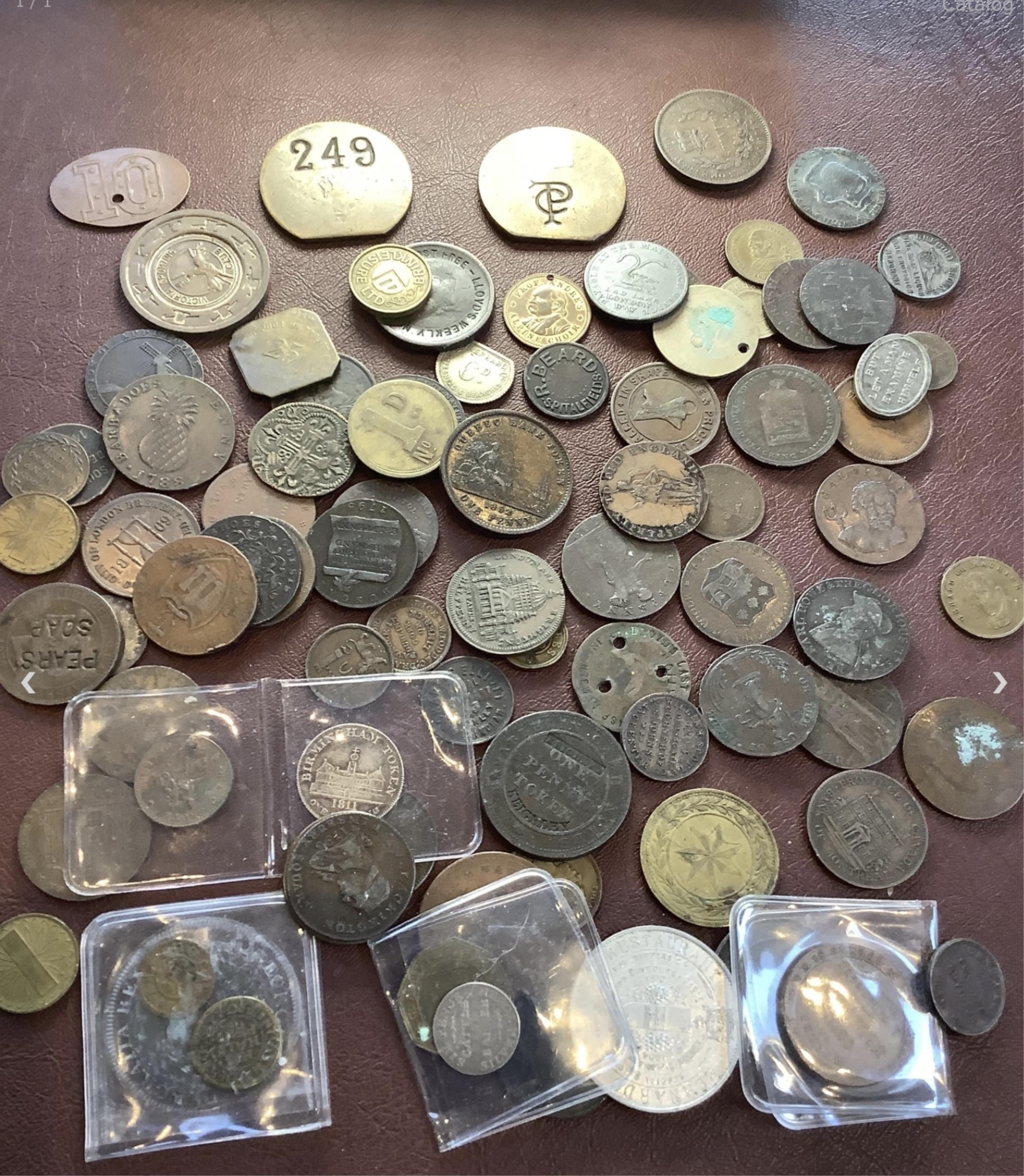 A Birmingham silver shilling token and a collection of copper tokens including two 17th century, British and British dependencies brass and copper tokens including Barbados Penny, 1788, Québec bank token 1852, one Penny,
